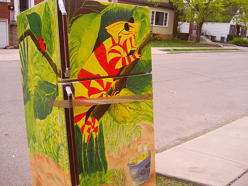 queenston:  i’ve seen some ridiculous shit on the curb across the street this tops it all a fridge with a painting of a  chameleon with shades above a bucket of corona 