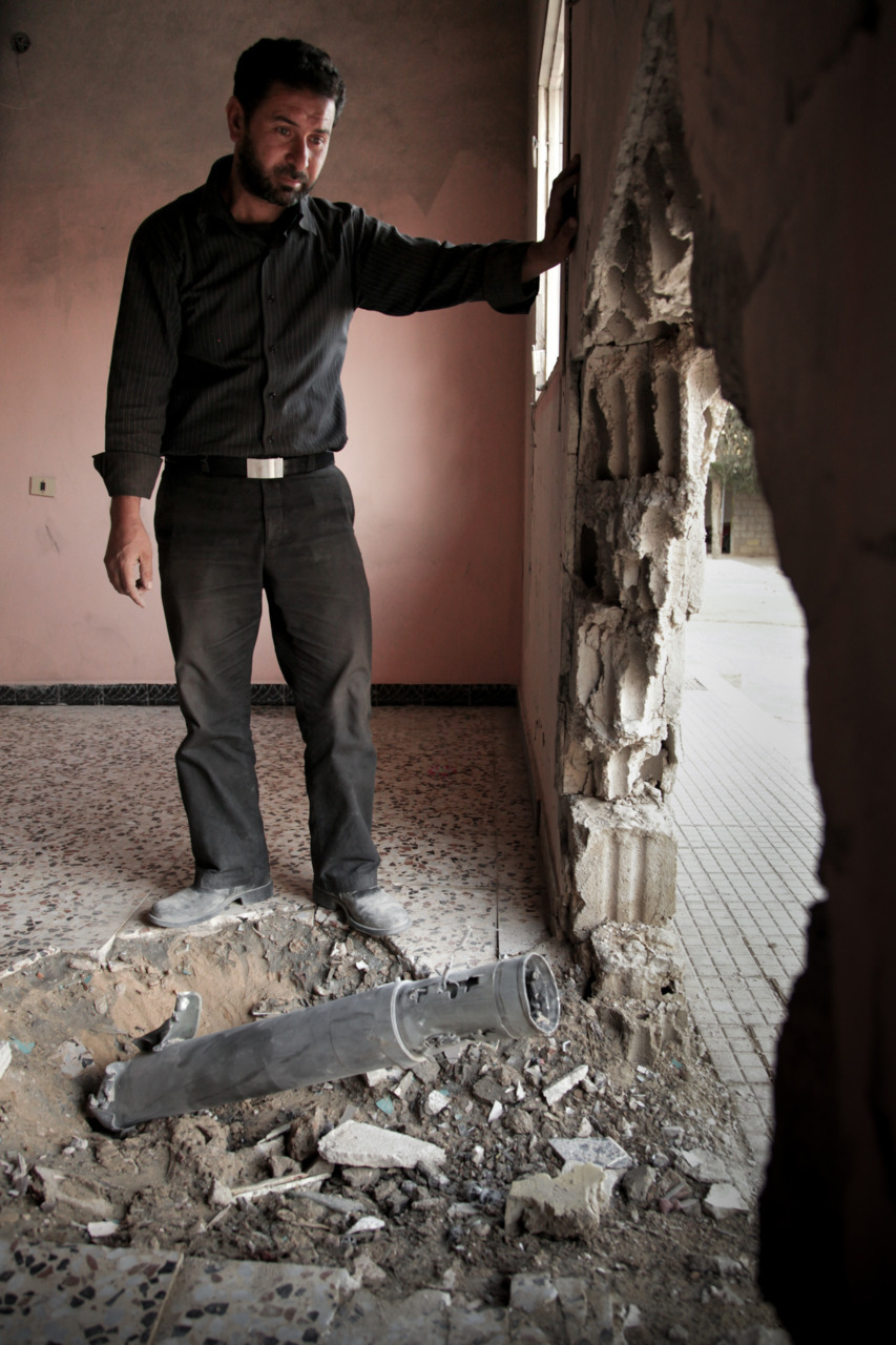 Mustafa Mohammad Shami, a teacher from Misrata, stares at the hole in his home where a rocket killed his baby daughter, Rodaina, and his three year old son Mohammad. His only surviving child, Malak, 5, had to have her right leg amputated above the...