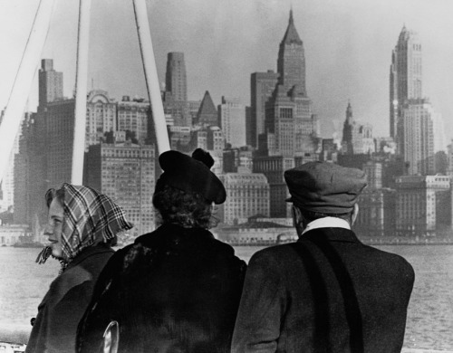 Immigrants Looking at New York Skyline