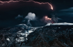 Newsflick:  A Lightning Bolt Streaks Across The Sky As A Volcano Erupts. This Is