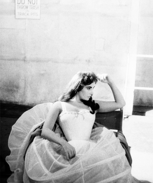 avagardner:Elizabeth Taylor on the set of Raintree County photographed by Bob Willoughby