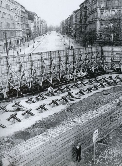 Olaf plays with his football beside the Berlin Wall photo by Günter Zint; Bernauer Strasse, West Berlin, circa 1960s