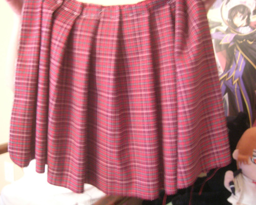 And here’s the skirt :D mind you its only being held in place by some loosely sewn in string, it still has to be sewn properly together, that will be done later. Ignore the Code Geass poster lmfao