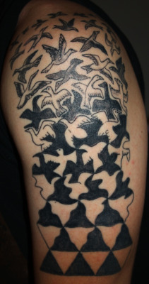 fuckyeahtattoos:  This is my boyfriend’s tattoo of MC Escher’s “Liberations” on his left arm. Done by Aaron Hamilton of Aerochild in Birmingham, Alabama. 