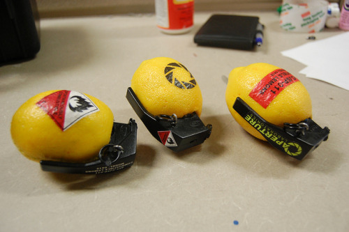 ianbrooks:  Combustible Lemons by Chris Myles “Tops from some old airsoft bb loaders, random springs to make the spoons fly off when you pull the pins, some paper plus modge podge labels, and a hacked greeting card so when the spoon comes off Cave does