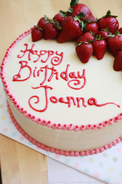 White velvet cake w. strawberry jam, pastry cream, vanilla buttercream. The writing was strawberry s