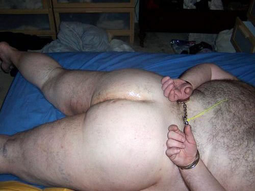 This naughty chubby has been forced to have his lubed bum photographed for porno blogs.