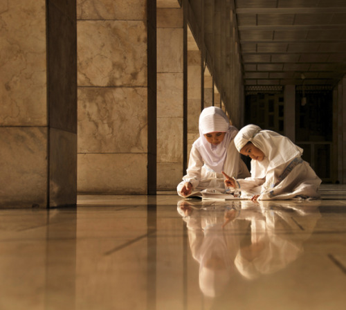 “Alif…Ba…Ta” A child learns to read the Qur'an in Jakarta, Indonesia. (pho