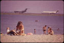 youlikeairplanestoo:  Nice shot from Constitution Beach looking toward Boston Logan International Airport (1973). Photo by Michael Philip Manhem courtesy of the National Archives. Full version here. 