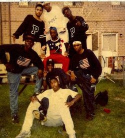  BROWNSVILLE, BROOKLYN. Circa 1990    Original Lo-Life Founders: (L-R top row) Og Dennis, Og Rack-Lo, Og Ski-Lo, (L-R Middle row) Og Reese-Lo, Og Shillz da Realz sitting in middle and Steve Austin to the right in blue flag sweater. Og Montoun-Lo in Blue