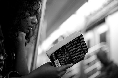 readinginmotion:Reading on the 4 Train (by pamhule)