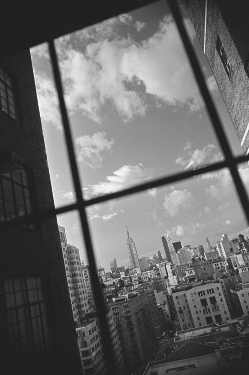 bagnostian:  sky full of clouds. north from greenwich village. (Nikon FM2) 