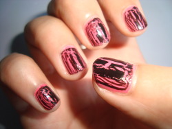 nhiii:  My pink with black crackle nails.