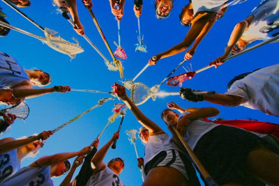 Girls lacrosse huddle with sticks HDR by TheUSH on Flickr.