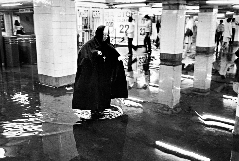 1980, A nun was among the subway riders faced with a flooded path as she made her