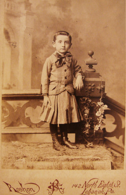 blackandwtf:  1890 A young boy named Henry Light poses in a dress. The photographer was  Christian S. Roshon, he operated a photography business across the state of Pennslyvania.  Young boys commonly wore dresses in the 19th century, but by 1905 it was