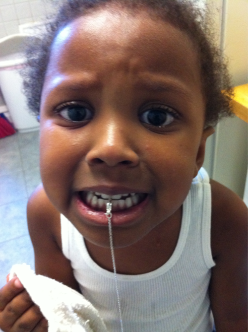 The joys of parenting. This girl got the clasp of the chain between her teeth! It took about 15 minutes to get this off without having to pull a tooth or something. Scared my poor baby so bad she said she needed a nap. Aww.