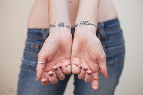 Erin&rsquo;s tattoos, which read &ldquo;Vita Brevis, Ars Aeternus,&rdquo;
