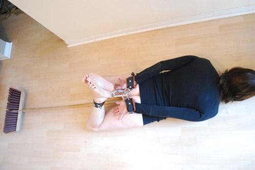 sluttybunny:  Hogtied on the floor with the broom handle stuck up my pussy.