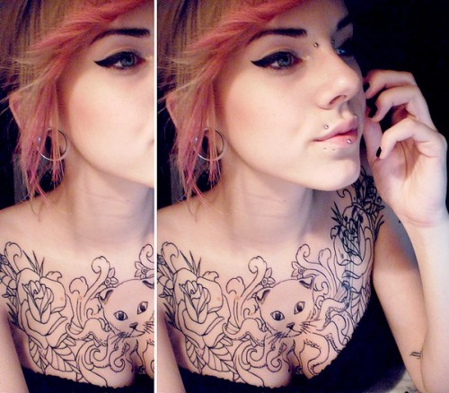 Flesh tunnel, anglbites, labret and bridge piercing.And of course a GOURGEUS kittopus tattoo! &l