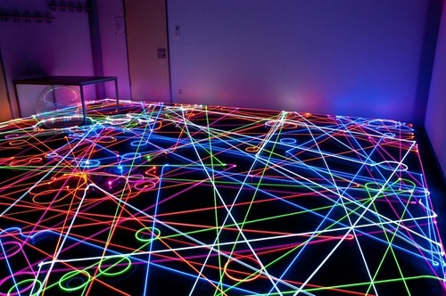 “This light painting photograph was created by a group of students over in Germany using a swarm of seven Roomba automated vacuum cleaners. Each one had a different colored LED light attached to the top, making the resulting photo look like some kind...