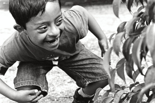 After a sudden rain cancels his soccer game, Luis Angell plays hide and seek with his mother photo by Tanya Workman, 2008