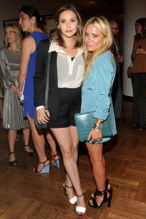 luckymag:Here Lizzie Olsen is with Mary-Kate at The Row’s launch party for its handbags collection