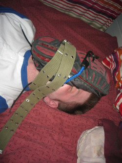 fagfetish:  The 5 hours he lay there felt even longer than they already were. The belt was so tight it hurt his neck. Breathing was extremely difficult, he felt like he would suffocate every second. And yet he knew that this was his right place. 