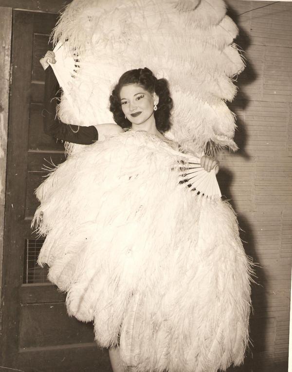 An unknown Fan Dancer, poses backstage..