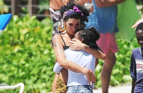 whisperintoass:anthagio:dylanludwig:Amy Winehouse was in the middle of adopting a poor St. Lucian gi