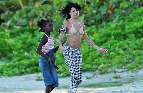 whisperintoass:anthagio:dylanludwig:Amy Winehouse was in the middle of adopting a poor St. Lucian gi