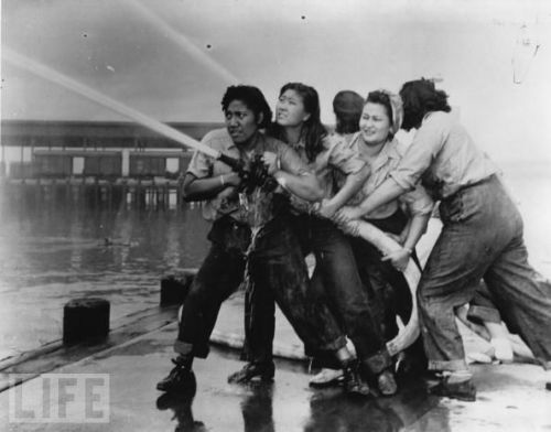 idiopathicsmile:fullofwhoa:glockgal:madlori:Women firefighters douse flames during the Pearl Harbor 