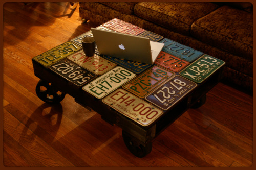 License Plate Table by Leo Kempf found here.  Stained pallet on 8&quot; antique cast-iron caster whe