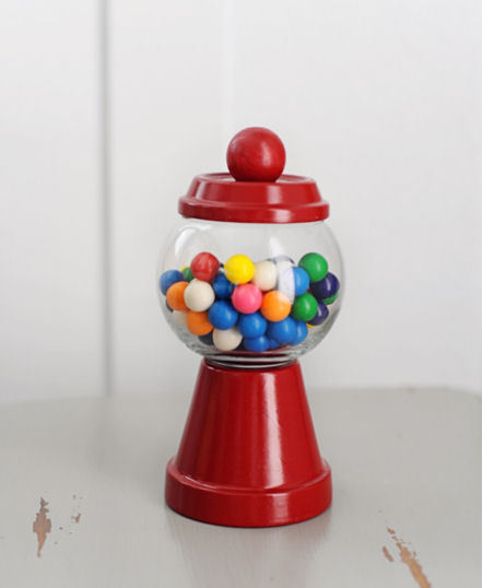 Mini Individual Gumball Machines | Tammy Mitchell
These are the cutest party favours I have ever seen! They’re made out of the simplest little things too - a terracotta pot and its base, a votive holder, a wooden ball and some red spray paint! Easy...