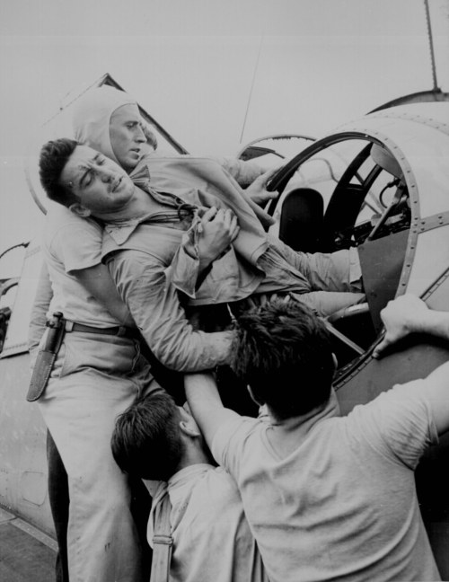 dogatemytank: © Lt. Wayne Miller 1943 Pvt. Kenneth Bratton is lifted out of a turret of a TBF o