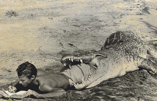 ecrirencore:  Most unusual of the lots is a self-portrait of photographer and adventurer Peter Beard writing his diary in 1965 from the jaws of a giant African crocodile. The 15 foot crocodile was dead 