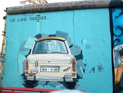 The Berlin Wall (German: Berliner Mauer) was a barrier constructed by the German Democratic Republic (GDR, East Germany) starting on 13 August 1961, that completely cut off West Berlin from surrounding East Germany and from East Berlin. 