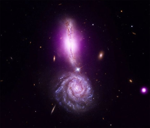 mothernaturenetwork:  Stunning photo shows colliding galaxies forming exclamation point in spaceCollision provides a model for how the Milky Way and Andromeda galaxies will merge billions of years from now. 