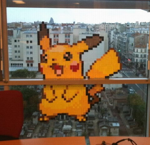 French people having "Post-It Wars" with workers from buildings across