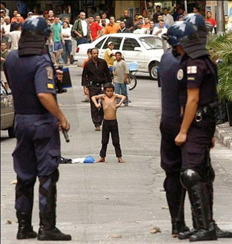 theholykaron:  oh-phelia:  Taken from Cracked.com’s “6 Images of Kids Too Insane to Be Real (That Totally Are)”:  “The photographer has this child tagged as a ‘street boy.’ That’s not a generic descriptor. In Sao Paulo ‘street child’