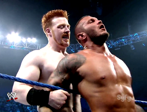 pervyrasslincaps:  Just when Orton thought that one rape threat had been overcome, in comes another one from over the horizon. In the form of an African-American weightlifter.  Uh….O.O Both Sheamus and Randy look like they are enjoying themselves!