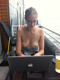 Dayna writing her blog update on patio. Check