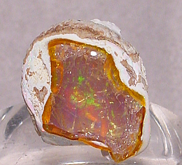 Fire Opal Opal is an emotional stone and reflects the mood of the wearer. Opals are worn during trip