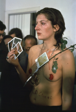 theneongypsy:  Rhythm 0, 1974      To test the limits of the relationship between performer and audience, Abramović developed one of her most challenging (and best-known) performances. She assigned a passive role to herself, with the public being the