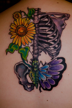 fuckyeahtattoos:  My second tattoo represents a lot of things for me. My dad and I used to grow sunflowers in our backyard. Even though our house was shit, I loved looking out my window and seeing those flowers. He committed suicide when I was eight.