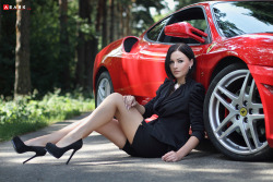 the beautiful woman &gt; the car  nothing like long sleek sexy legs :)