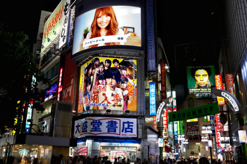 Huge AKB48 &amp; Happy Mail billboards lighting up Shibuya at night.