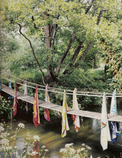A footbridge, decorated with Hermes scarfs, over a river near Natalia Vodianova’s estate in England