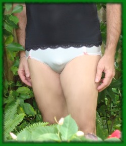 Pattie in the garden wearing panties and