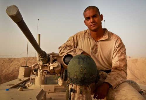 Staff Sgt. Georlis Rodriguez of Brooklyn, N.Y., sits atop his M1A1 Abrams Main Battle Tank. The tank